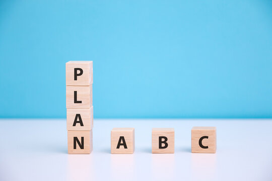 Wooden cube with PLAN A, B, C word. The concept of planning in business.