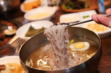 Korean cold noodles in chilled broth