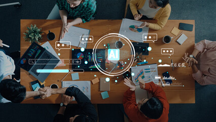 A diverse team engages in data analysis and strategic planning in a modern workspace, utilizing AI technology to foster collaboration and innovation for business success. Trope