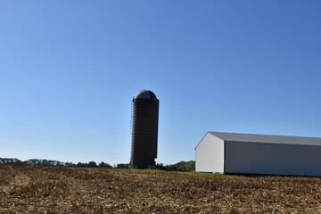Silo and Barn in a Farm Field
