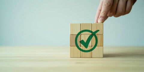 Sure! here's the output based on your instructions:

Checkmark Cube Confirmation: A hand gently places the wooden block with the green checkmark, symbolizing agreement, completion.