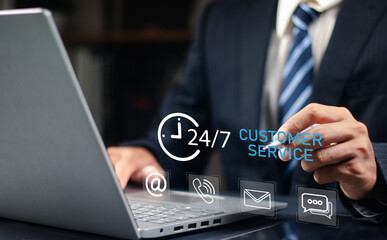 24-7 customer service support concept. Businessman hands holding digital contact icons, including email, phone, and chat, representing communication, accessibility, and online business care.