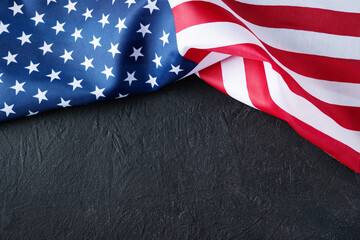 United States flag on black backdrop with copy space, great for banners, posters, and digital designs for patriotic events such as Independence Day, Veterans Day, Labor Day,Memorial Day.