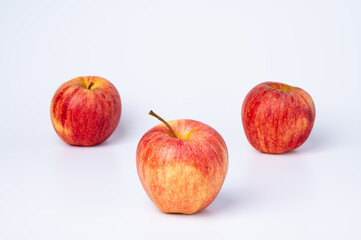 Three Red Apples on White Background
