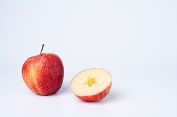 Whole and Half Red Apple on White Background