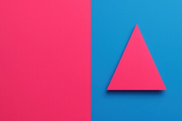 Fototapeta premium A vibrant red triangle stands out against a blue backdrop, symbolizing balance and harmony in contrasting colors