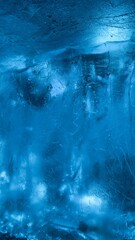 Close-up of ice texture with cracks and blue hues: natural abstraction for design, environmental themes, and visual art