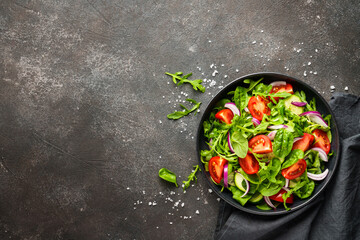 Fresh salad with leaves and vegetables.