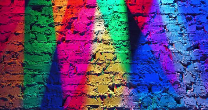 Lighting from lamps with varicolored colors. Play of colors, light and shadow on real brick wall. Real lighting from lamps of different colors