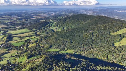 A breathtaking aerial view showcasing lush green hills and a stunningly vibrant landscape scenery