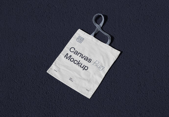 Lying on Concrete Canvas Bag Mockup