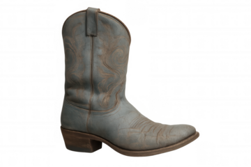 Single cowboy boot showing worn leather texture and intricate embroidered patterns, representing western culture and fashion
