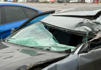 A broken windshield of a car as a result of a traffic accident. Dangerous, careless, unsafe, drunk,...