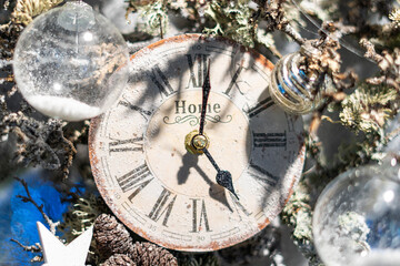 Vintage clock with snow and Christmas ornaments