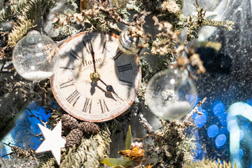 Vintage clock with snow and Christmas ornaments