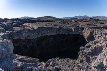 Lava tube. Indian Tunnel. Basalt Lava Flows. Caves Trail, Craters of the Moon National Monument & Preserve. Volcanic Field. Idaho's eastern Snake River Plain. 