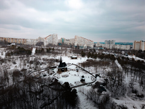 The Intercession of Virgin Mary Wooden Church from Hirișeni, Moldova - Wooden Orthodox Church and The City of Chisinau in the background 
Biserica de Lemn din Hirișeni &bdquo;Adormirea Maicii Domnului&rdquo;