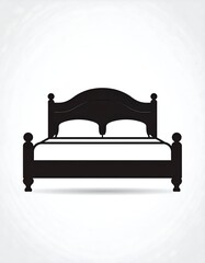 Silhouette of a double bed, pillows, and ornate headboard