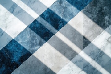 Diagonal tiled surface featuring a mosaic of white marble, blue and grey stone textures, dramatically highlighted by parallel sunlit shadows.