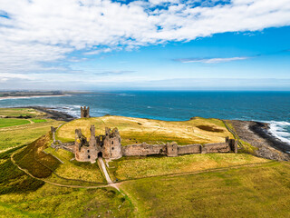 Dunstanburgh Castle from a drone, Northumberland Coast, England