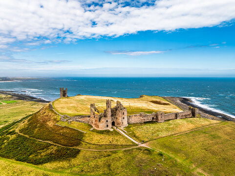 Dunstanburgh Castle from a drone, Northumberland Coast, England