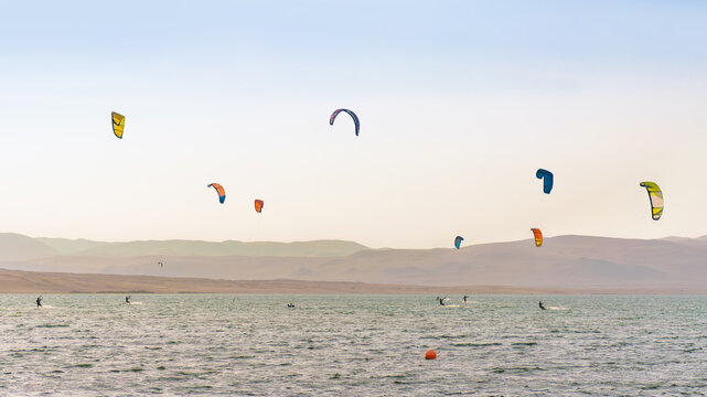 Kitesurfin in Paracas, Peru with a clear sky, summer in the beach
