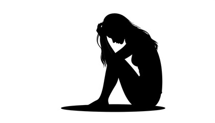 Silhouette of a woman sitting with head in hands, showing despair