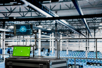 Green screen laptop in server room with machine learning technology detecting data patterns. Chroma key notebook in data center ensuring rapid data access and transfer rates for AI processing