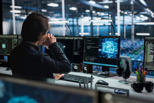 Technician in data center drinking coffee and optimizing hardware for AI tasks. Server hub employee enjoying caffeinated beverage at work, automating system diagnostics using deep learning