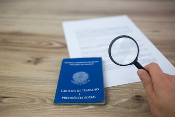 Brazilian work card with document and magnifying glass