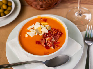 Cordoban salmorejo with ham and egg shavings is a traditional Spanish cold tomato soup.