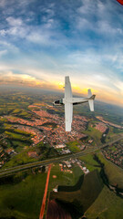 Cessna Caravan airplane diving through the sky at a beautiful sunset in Brazil