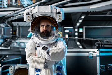 Portrait of astronaut testing helmet systems during routine equipment check inside orbital station....