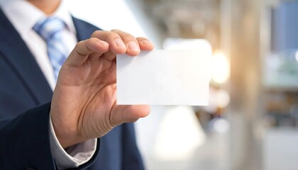Business card held by man