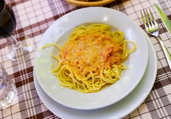 Plate with pasta, made with in a salmon sauce