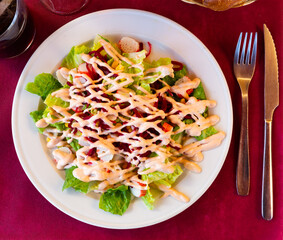 Delicious salad with crab meat, fresh lettuce, corn and grated beet seasoned with pink sauce of mayonnaise, ketchup and Worcestershire sauce..