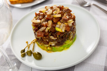 Appetizing french tuna fish tartare served on platter