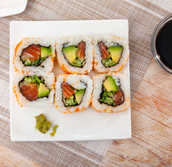 Set of uramaki rolls with salmon, avoado and cucumber