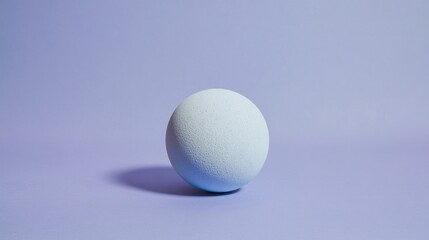 Single pale egg on a muted lavender background