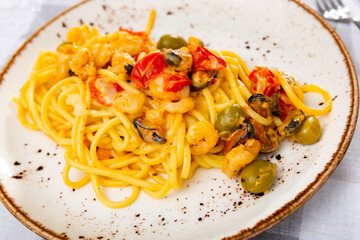 National dish of Mediterranean cuisine is pasta macaroni with seafood, cooked with addition of...