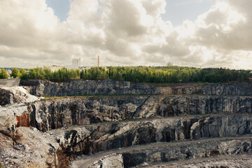 Open pit quarry with winding roads viewed from above