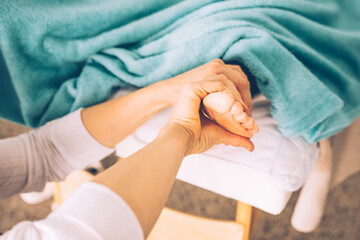 Caucasian hands giving a foot massage, Reflexology