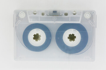 close up of dirty transparent cassette tape isolated on white background