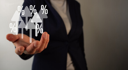 Businesswoman's hand holding several arrows making with percentage signs