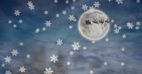 Naklejka premium Image of snow falling over santa claus in sleigh with reindeer on sky over moon