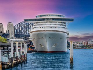 Naklejka premium Cruise Liner in Circular Quay on Sydney harbour NSW Australia The harbour bridge in the background