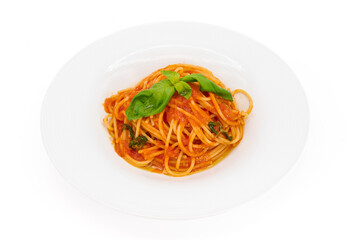 Classic Italian pasta, Spaghetti with tomato sauce and basil on a white plate