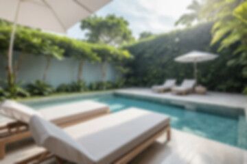 Fototapeta premium Blurred background of a modern swimming pool with lounge chairs beside it for visitors to relax, with a charming sunset.