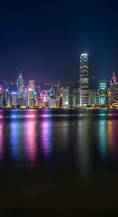 Fototapeta premium Vibrant Night City Skyline Reflections.