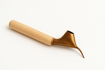 Traditional batik canting tool with wooden handle isolated on white background – Indonesian wax drawing instrument.